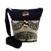 Medium-sized cushioned square-shaped purse bag with tree of life print pattern and coconut button and beads in beige and black color combination.