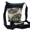 Medium-sized cushioned square-shaped purse bag with tree of life print pattern and coconut button and beads in beige and black color combination.