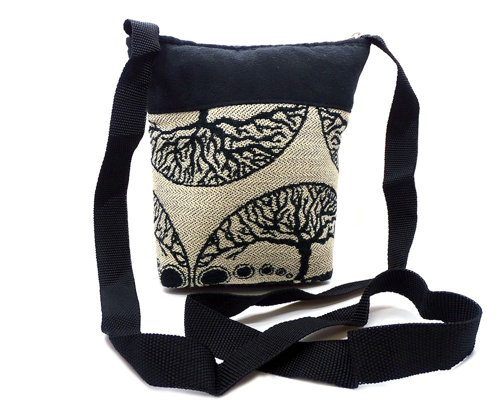 Medium-sized cushioned square-shaped purse bag with tree of life print pattern and coconut button and beads in beige and black color combination.
