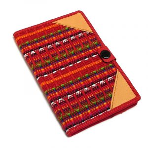 Handmade small woven cotton refillable notebook cover with multicolored stripes in red color.