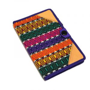 Handmade small woven cotton refillable notebook cover with multicolored stripes in purple color.