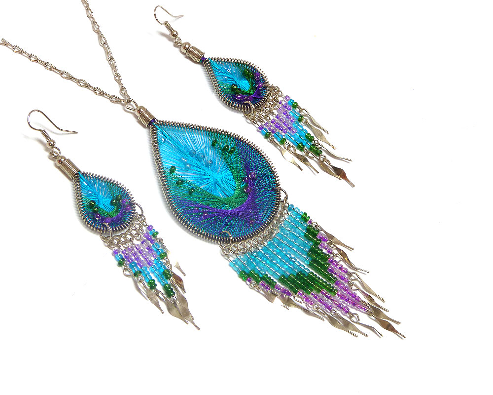 NS-010101350406 Handmade beaded teardrop-shaped silk thread necklace and matching earrings with long seed bead and alpaca silver metal dangles in turquoise blue, green, and purple color combination.