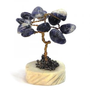 Handmade golden-colored metal wire and tumbled blue sodalite gemstone crystal tree of life table ornament with crushed pyrite and a round stone base.