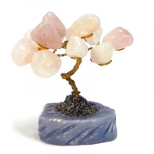 Handmade golden-colored metal wire and tumbled light pink rose quartz gemstone crystal tree of life table ornament with crushed pyrite and a round stone base.