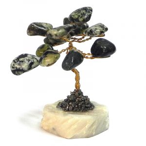 Handmade golden-colored metal wire and tumbled green serpentine gemstone crystal tree of life table ornament with crushed pyrite and a round stone base.