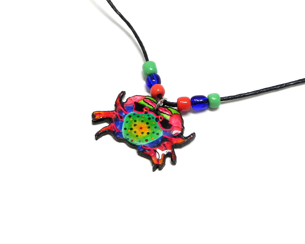 Handmade tropical crab acrylic pendant with seed beads on black necklace in red, blue, green, and yellow color combination.
