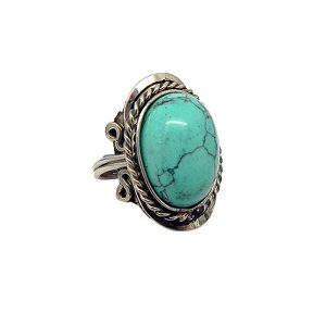 Handmade oval-shaped semi-precious gemstone cabochon on alpaca silver metal ring with rope edge border in turquoise howlite.