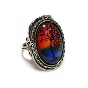 Handmade oval-shaped acrylic New Age themed sunset tree of life graphic design on alpaca silver metal ring with rope edge border in orange, blue, and black color combination.