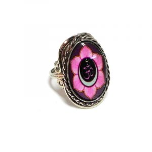 Handmade oval-shaped acrylic New Age themed floral om sign graphic design on alpaca silver metal ring with rope edge border in pink, burgundy, black, and white color combination.