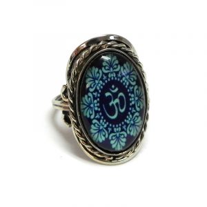 Handmade oval-shaped acrylic New Age themed floral mandala om sign graphic design on alpaca silver metal ring with rope edge border in navy blue and turquoise color combination.