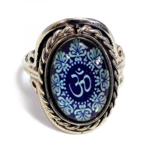 Handmade small oval-shaped acrylic New Age themed floral om sign graphic design on alpaca silver metal ring with rope edge border in dark navy blue and turquoise color combination.