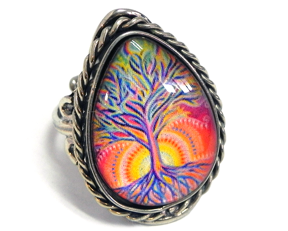 Handmade teardrop-shaped acrylic New Age themed sunrise tree of life graphic design on alpaca silver metal ring with rope edge border in peach, orange, golden yellow, hot pink, and blue color combination.