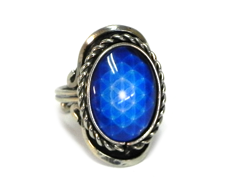 RG-050105051500 Handmade small oval-shaped acrylic New Age themed sacred geometry flower of life graphic design on alpaca silver metal ring with rope edge border in blue and white color combination.