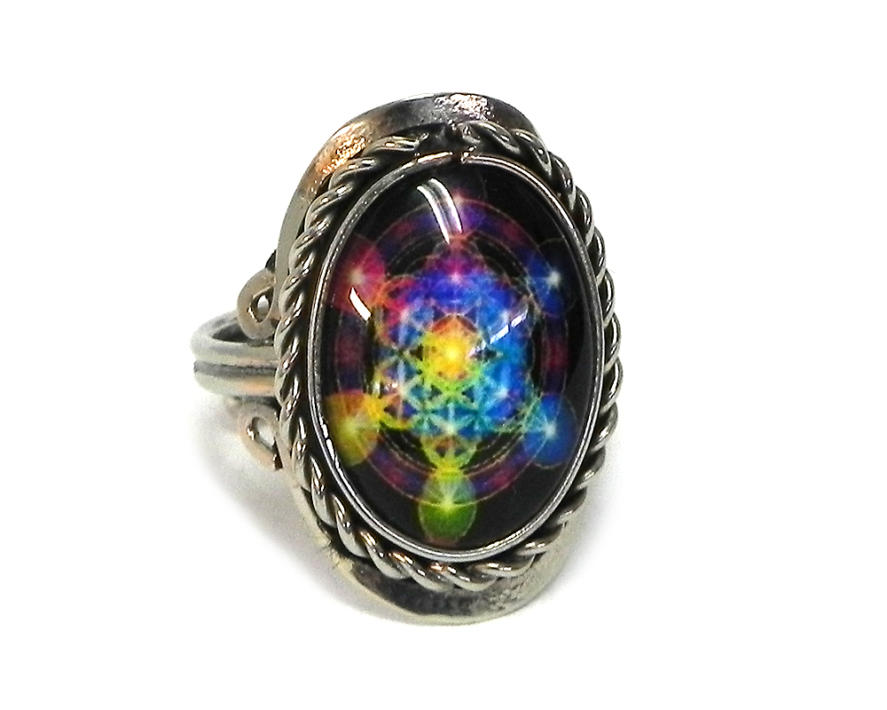 Handmade small oval-shaped acrylic New Age themed sacred geometry merkabah graphic design on alpaca silver metal ring with rope edge border in black and rainbow color combination.