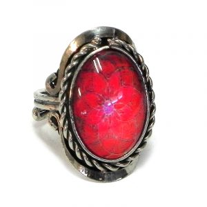 Handmade small oval-shaped acrylic New Age themed floral mandala graphic design on alpaca silver metal ring with rope edge border in red and hot pink color combination.