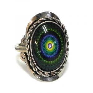 Handmade small oval-shaped acrylic New Age themed mandala graphic design on alpaca silver metal ring with rope edge border in dark green, indigo purple, yellow, and black color combination.