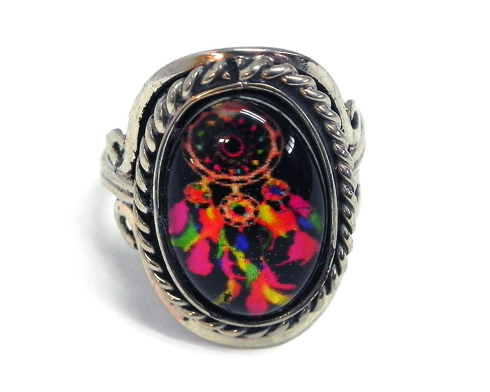 Handmade small oval-shaped acrylic Southwest themed dream catcher graphic design on alpaca silver metal ring with rope edge border in black and multicolored color combination.