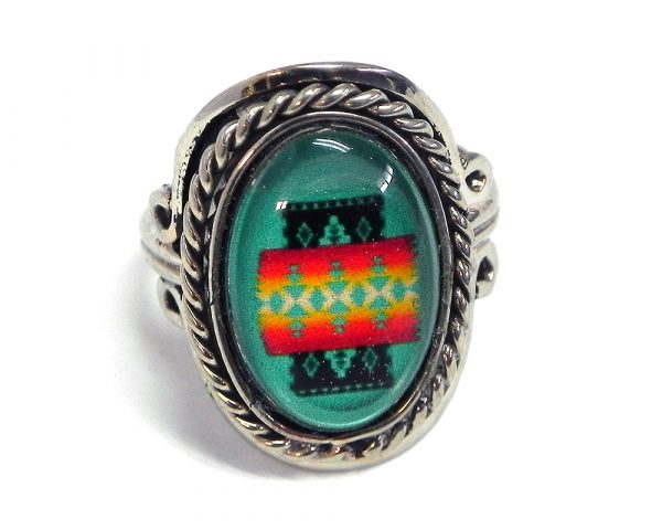 Handmade small oval-shaped acrylic Southwest themed pattern graphic design on alpaca silver metal ring with rope edge border in mint green, red, orange, yellow, and black color combination.