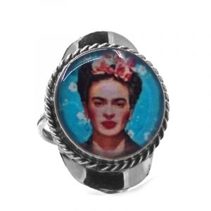Round-shaped acrylic Frida Kahlo face graphic design on alpaca silver metal ring with rope edge border in turquoise blue, white, peach, pink, red, and black color combination.