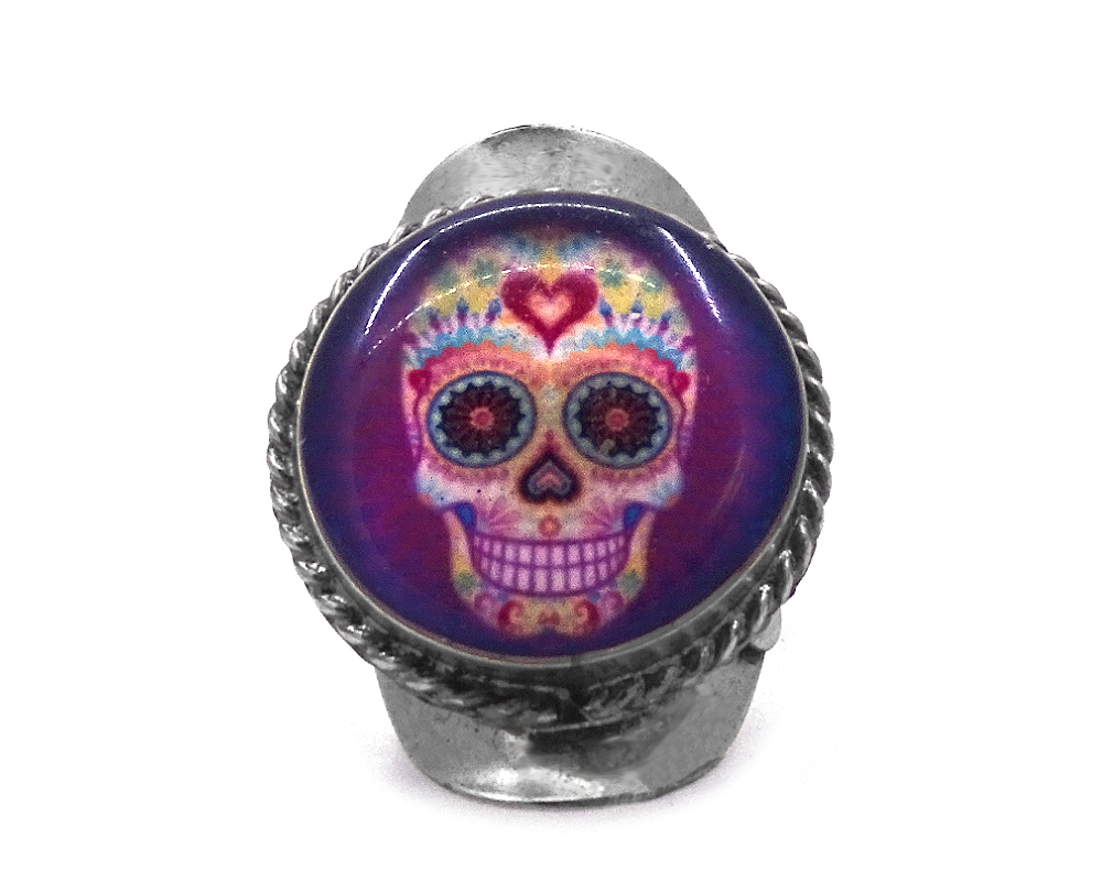 Round-shaped acrylic Day of the Dead sugar skull graphic design on alpaca silver metal ring with rope edge border.