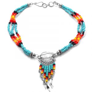 Handmade Native American inspired seed bead multi strand anklet with silver metal wire wrapped natural clear quartz crystal and beaded dangles in light turquoise blue, black, red, orange, and yellow color combination.