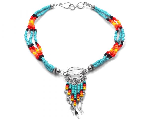 Handmade Native American inspired seed bead multi strand anklet with silver metal wire wrapped natural clear quartz crystal and beaded dangles in light turquoise blue, black, red, orange, and yellow color combination.