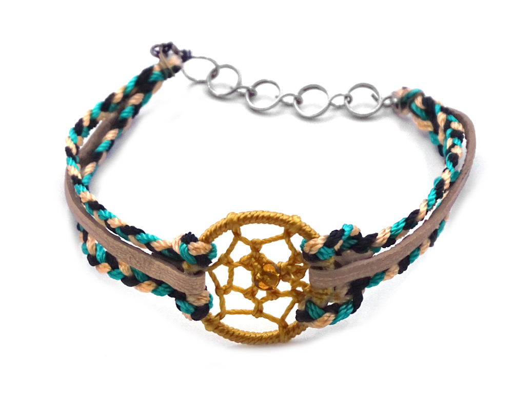Handmade vegan suede leather and multicolored braided macramé thread multi strand bracelet with round thread dream catcher centerpiece in golden yellow, beige, black, and teal color combination.