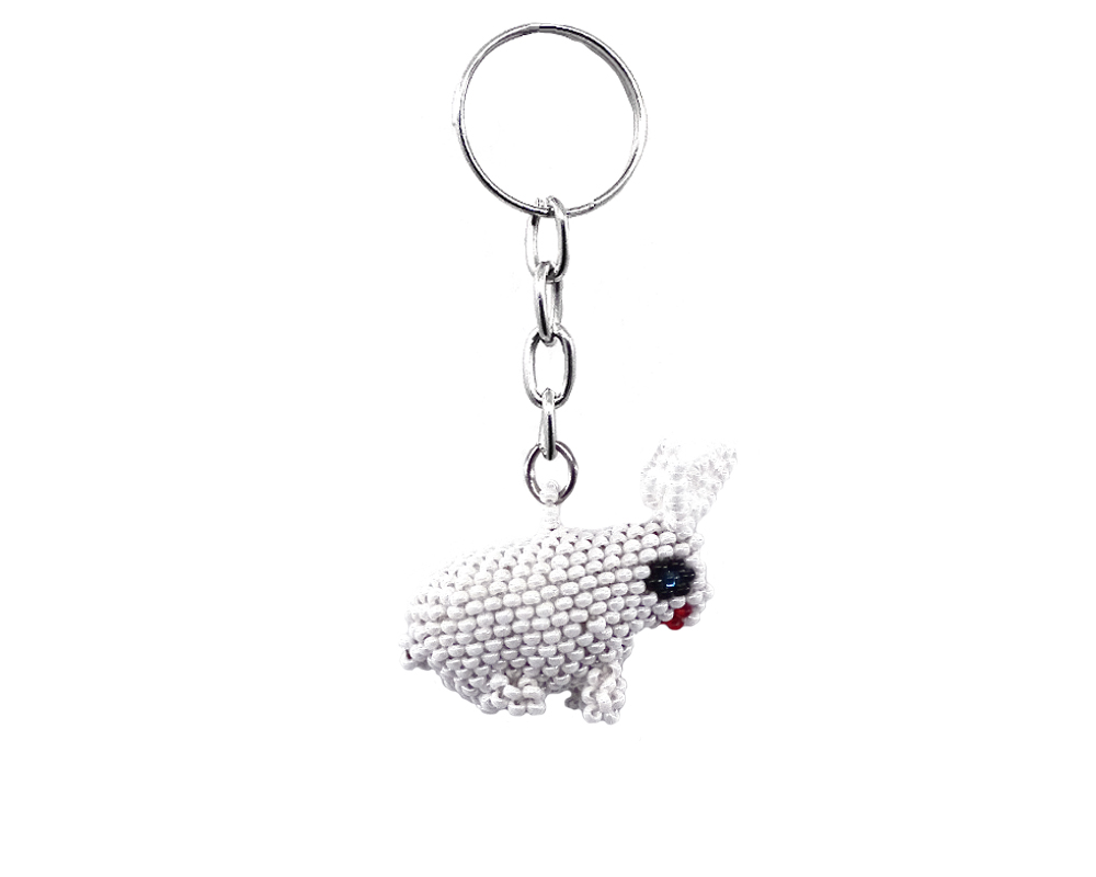 Handmade Czech glass seed bead figurine keychain of a white bunny rabbit in white, black, and red color combination.