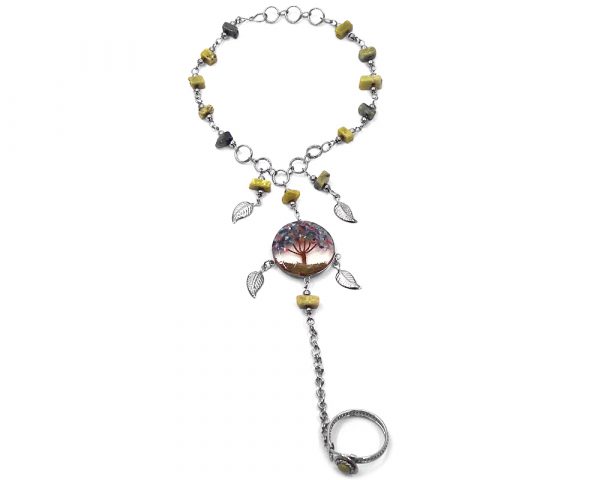Handmade alpaca silver metal chain harem bracelet with round-shaped clear acrylic resin, copper wire, and crushed chip stone inlay tree of life centerpiece and metal leaf charm dangles, linked to an adjustable ring in olive green serpentine and multicolored color combination.