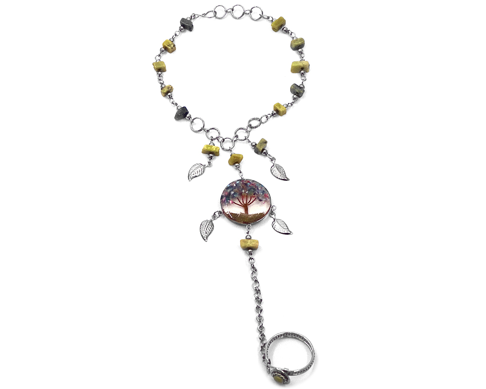 Handmade alpaca silver metal chain harem bracelet with round-shaped clear acrylic resin, copper wire, and crushed chip stone inlay tree of life centerpiece and metal leaf charm dangles, linked to an adjustable ring in olive green serpentine and multicolored color combination.