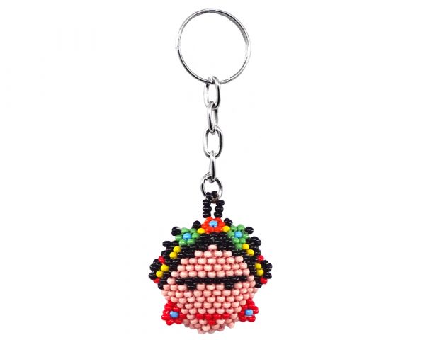 Handmade Czech glass seed bead figurine keychain of a Frida Kahlo head in peach, black, red, and multicolored color combination.