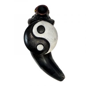 Handcrafted tobacco smoking natural bullhorn hand pipe of a classic black and white yin yang symbol.