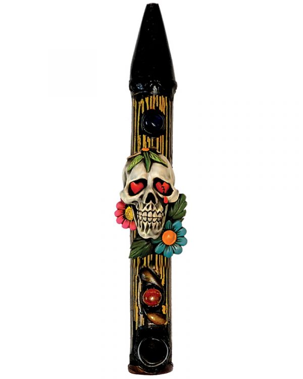 Handcrafted tobacco smoking natural bamboo wooden peace pipe of a white sugar skull with red heart eyes and multicolored flowers.
