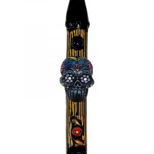 Handcrafted tobacco smoking natural bamboo wooden peace pipe of a blue Day of the Dead sugar skull with multicolored floral designs.