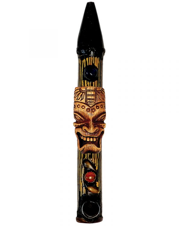 Handcrafted tobacco smoking natural bamboo wooden peace pipe of a tiki head mask of Polynesian god, Kane.