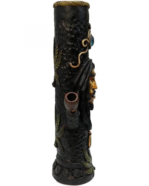 Handcrafted tobacco smoking water pipe of smoking Bob wearing green and gold peace sign necklace and decorative leaves.