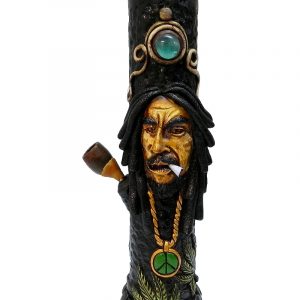 Handcrafted tobacco smoking water pipe of smoking Bob wearing green and gold peace sign necklace and decorative leaves.