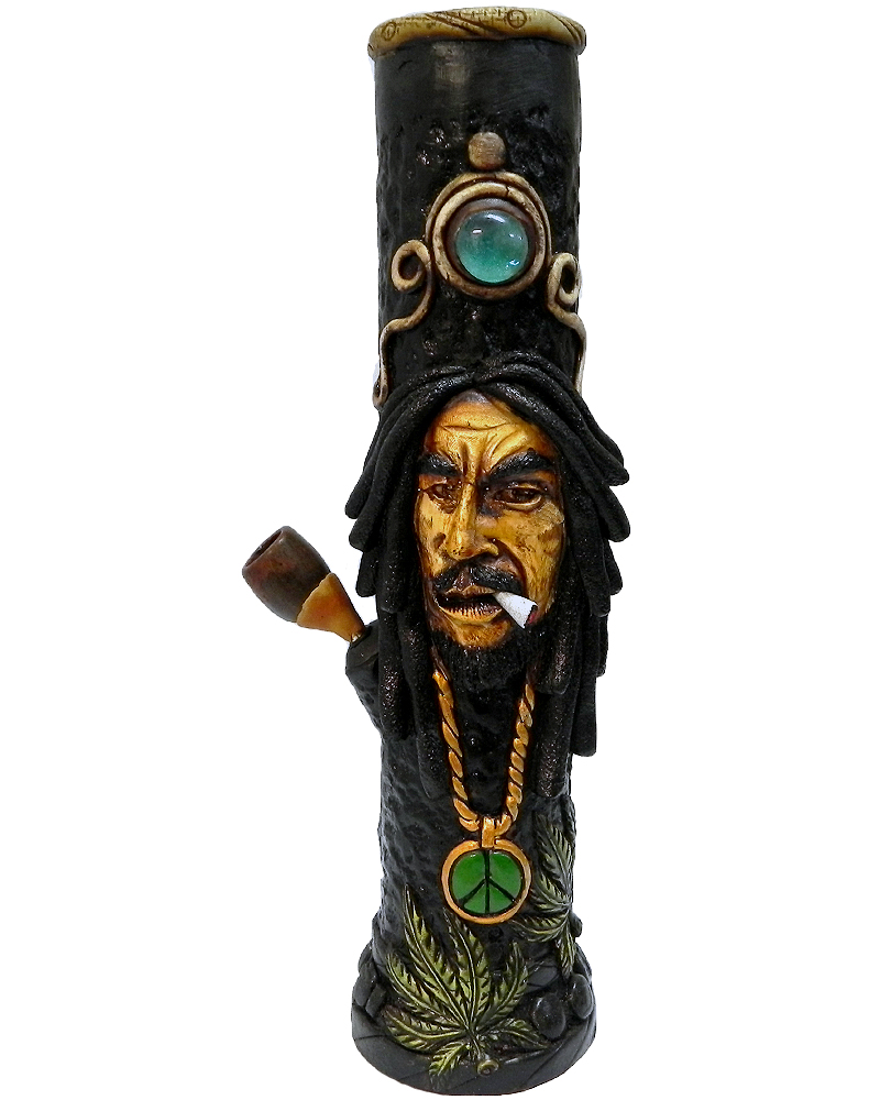 Handcrafted tobacco smoking water pipe of smoking Bob wearing green and gold peace sign necklace and decorative leaves.