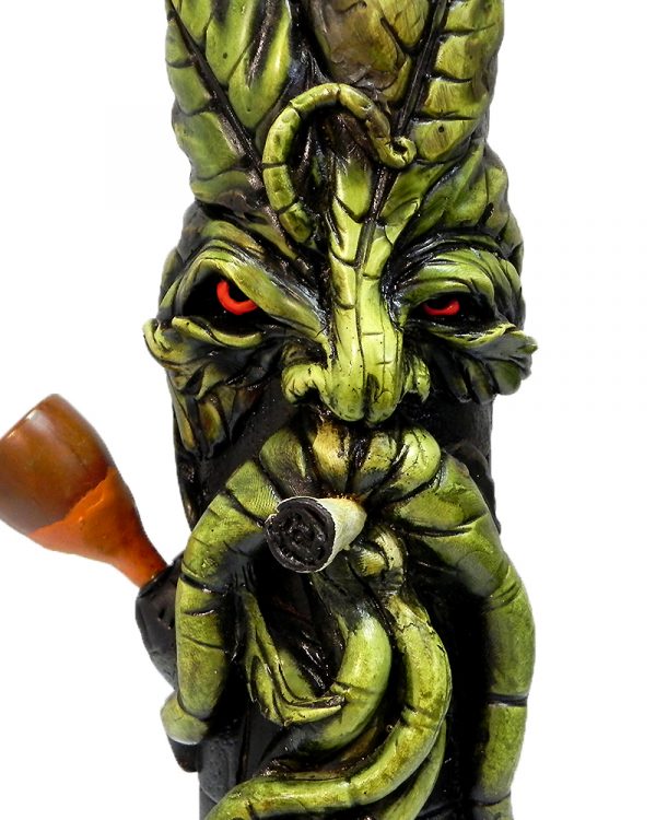 Handcrafted tobacco smoking water pipe of a smoking green leaf man face.