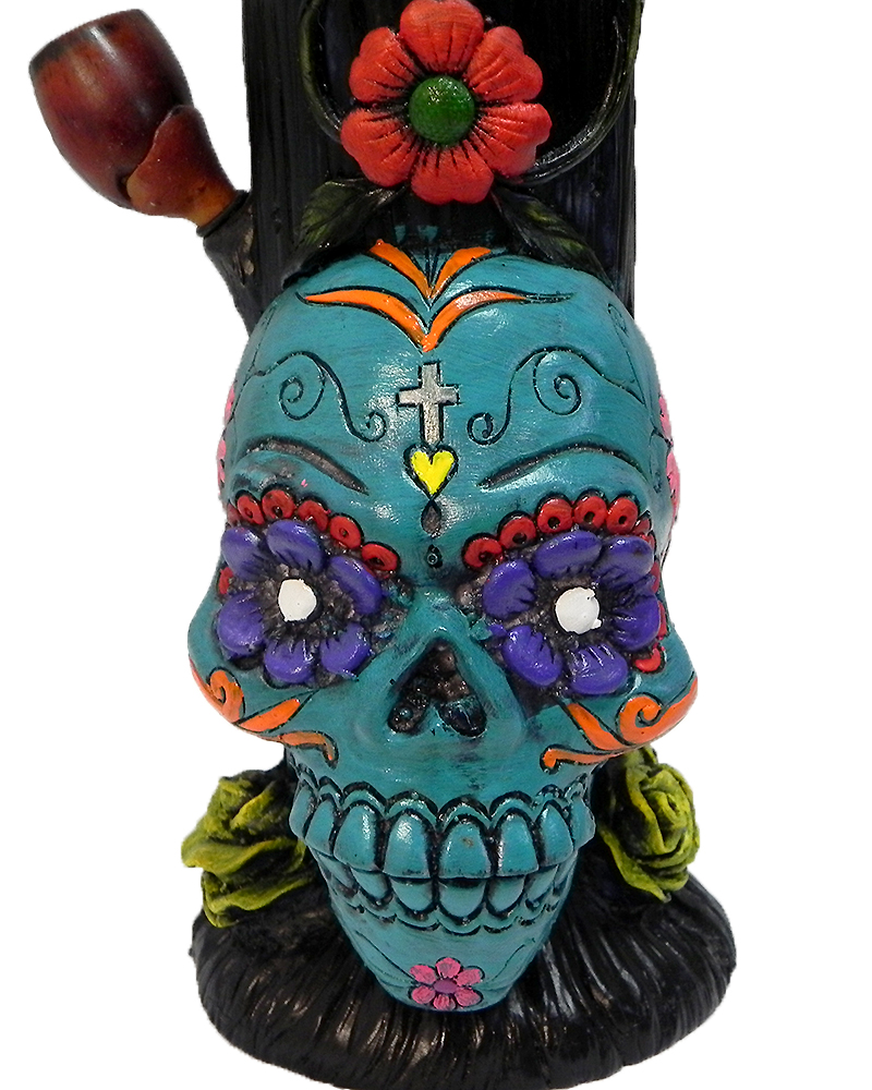 Handcrafted tobacco smoking water pipe of a Day of the Dead sugar skull with multicolored floral designs in turquoise blue color.