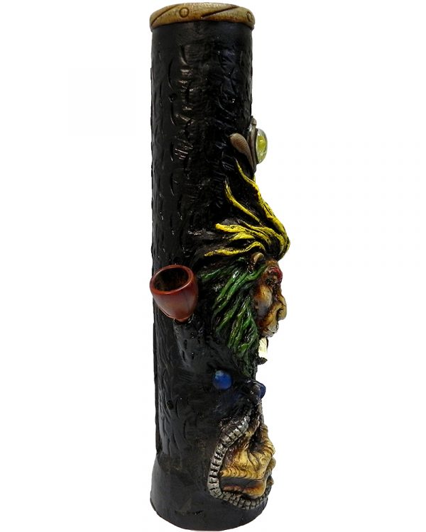 Handcrafted tobacco smoking water pipe of a smoking lion head with a scar on one eye, Rasta-colored mane, and green and gold peace sign necklace.