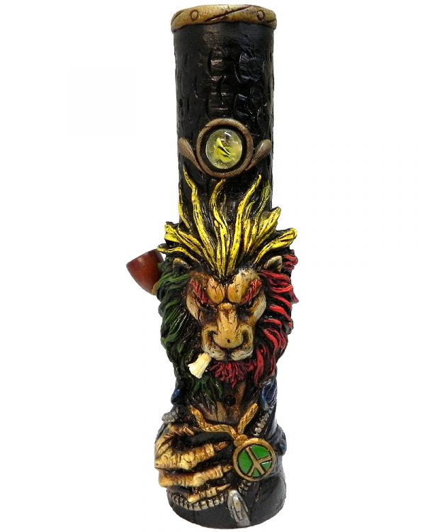 Handcrafted tobacco smoking water pipe of a smoking lion head with a scar on one eye, Rasta-colored mane, and green and gold peace sign necklace.