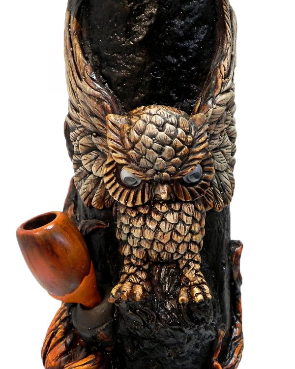 Handcrafted tobacco smoking water pipe of a brown owl with open wings over a brown tree.