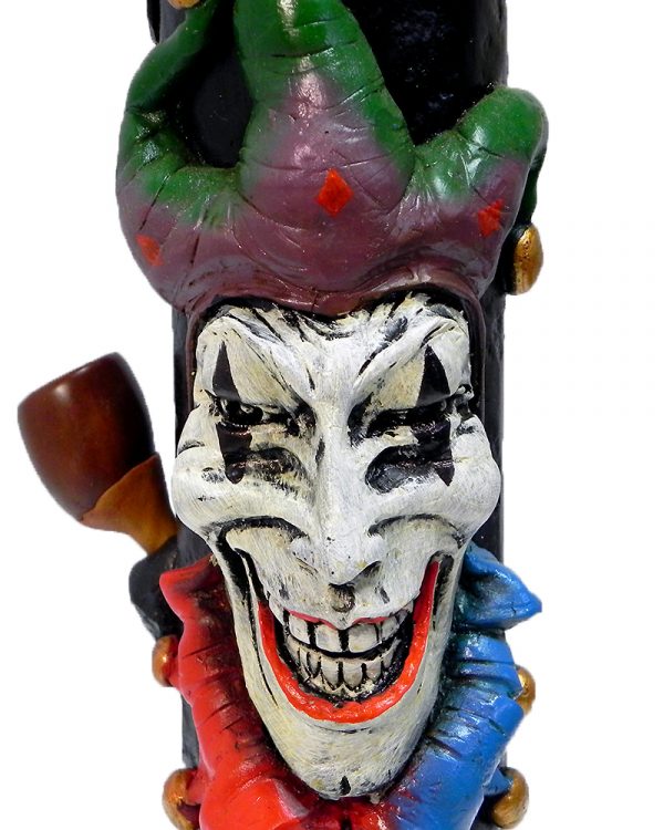Handcrafted tobacco smoking water pipe of an evil mad jester head with a creepy smile and a red, blue, and green suit.