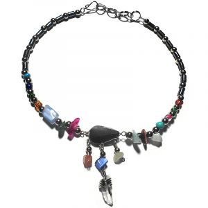 Handmade hematite and seed bead alpaca silver metal chain anklet with teardrop-cut black onyx stone cabochon, natural clear quartz crystal point, chip stones, and metal dangles in multicolored color.