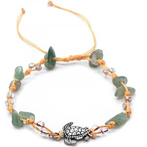 Handmade tied string pull tie anklet with chip stones, seed beads, and silver metal sea turtle charm in light green aventurine, clear, and beige color combination.
