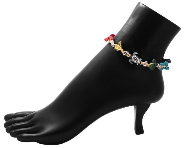 Handmade tied string pull tie anklet with rainbow colored chip stones, seed beads, and silver metal sea turtle charm in beige color.