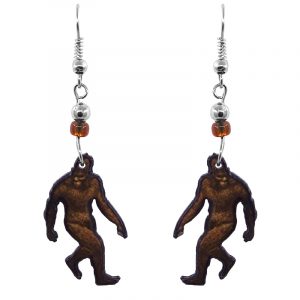 Handmade Bigfoot acrylic dangle earrings with beaded metal hooks in brown, tan, and black color combination.