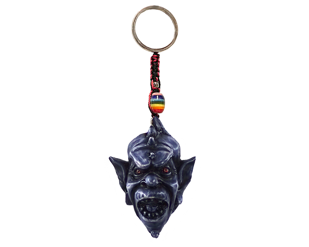Handmade durepox resin figurine keychain of a creepy gargoyle monster head.