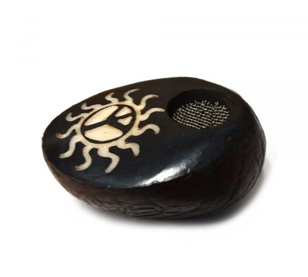 Handcarved tobacco smoking mini round natural tagua nut hand pipe bowl of a peace sign symbol inside of a tribal sun design.